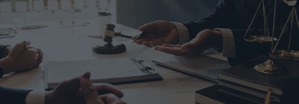 Scales of justice and a gavel on a lawyer's desk